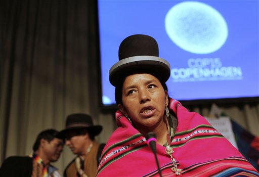 Bolivia'S Angelica Zarsuri, center, celebrates the mother earth rights during a presentation by the Bolivian delegation at the UN Climate Summit in Copenhagen, Wednesday, Dec. 9, 2009.  (AP Photo/Anja Niedringhaus)